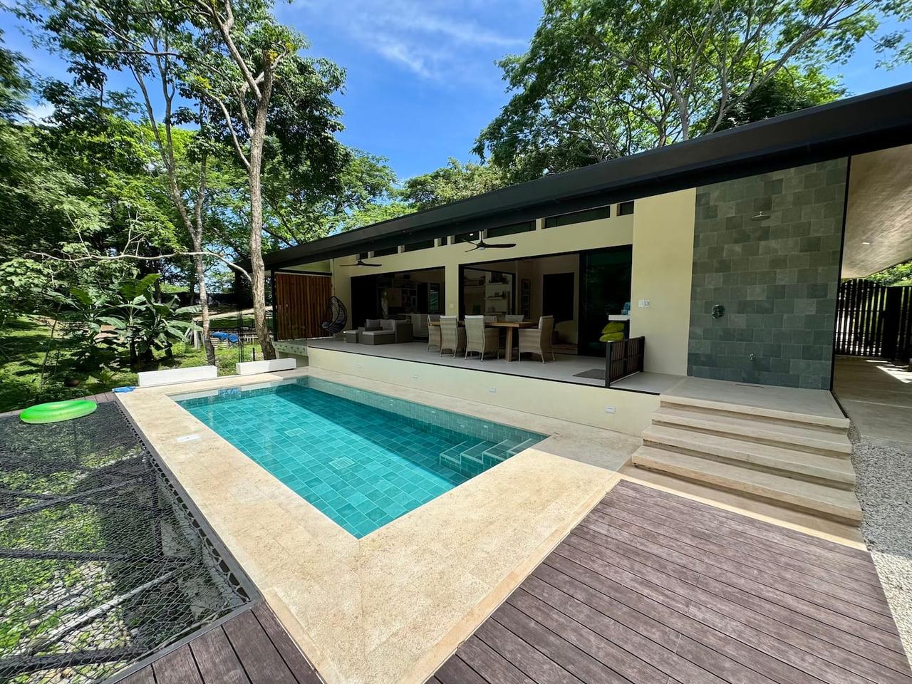 ArtVilla and its saltwater pool under the jungle canopy